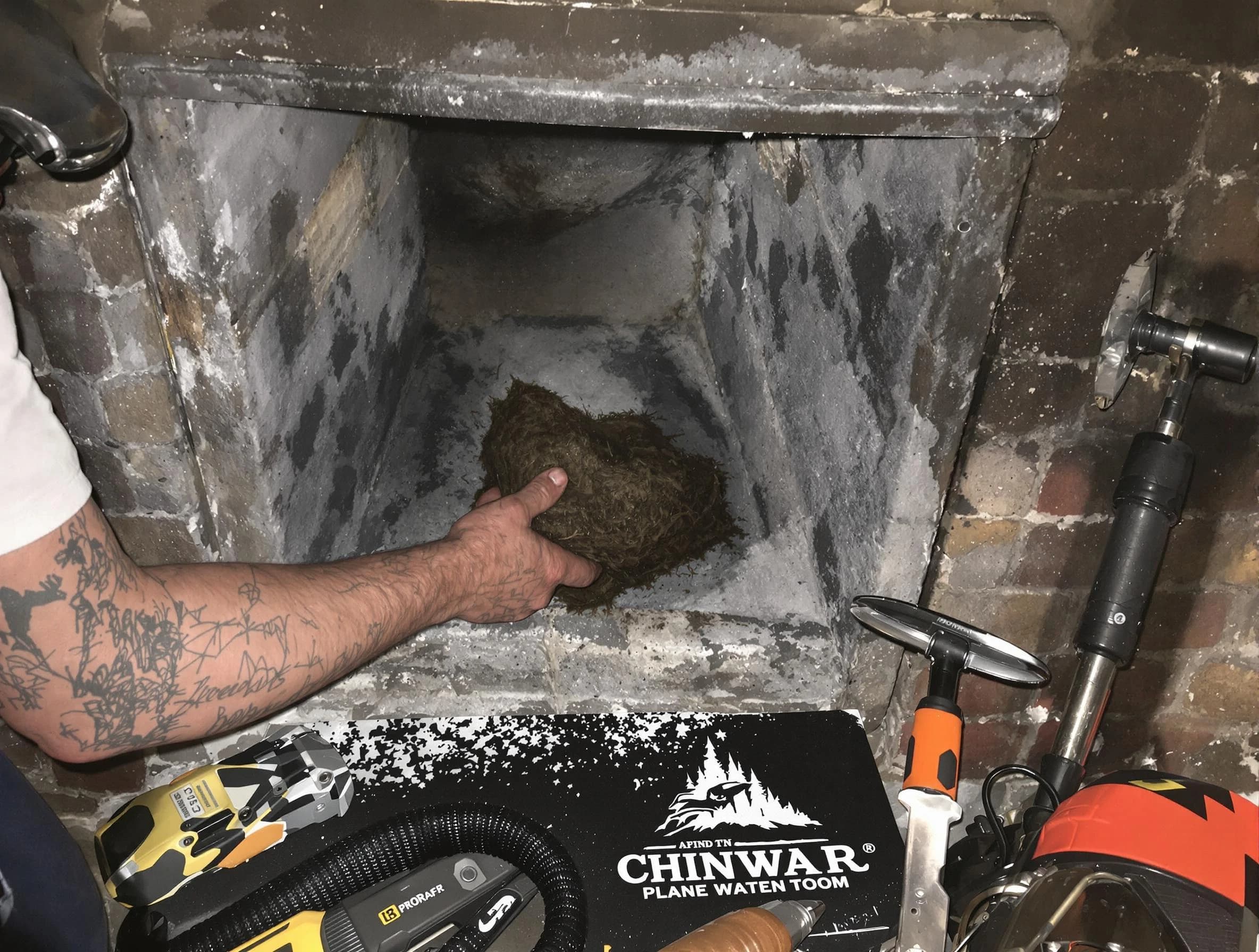 Fair Oaks Chimney Sweep safely removing debris and screening chimney in Fair Oaks, GA